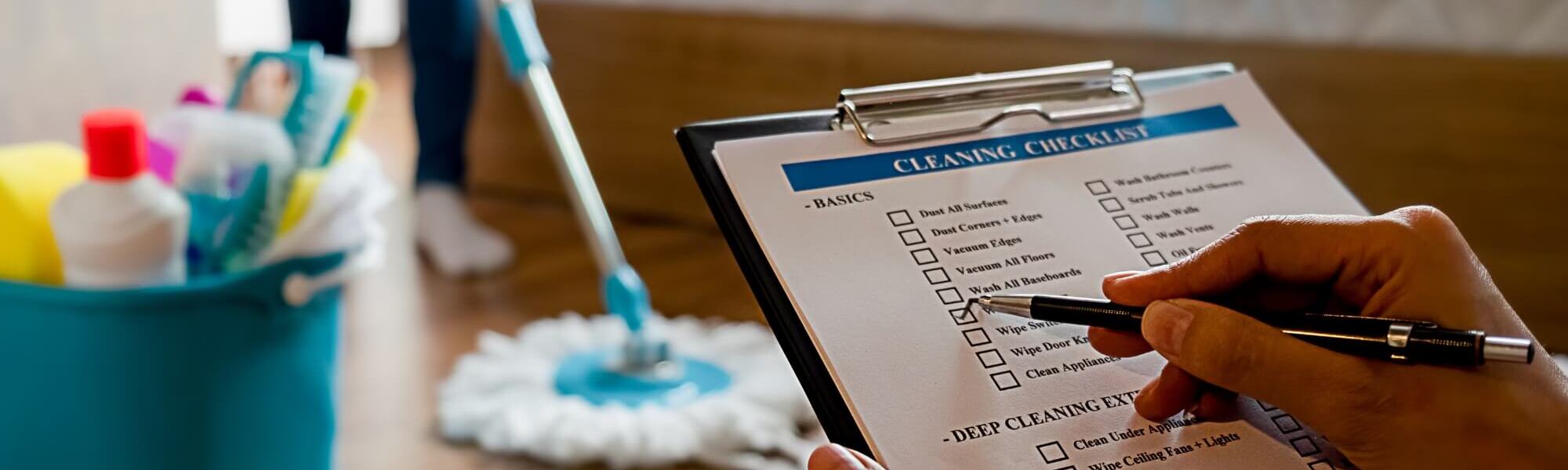 Supervisor checking boxes on the cleaning checklist